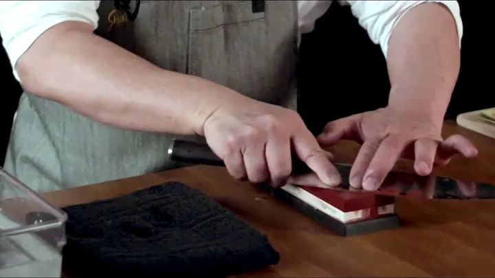 Sharpening a Shun knife on a whetstone